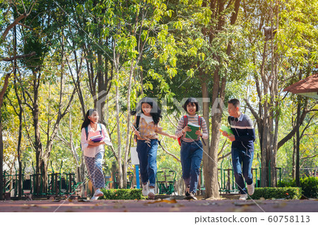 Group of student happy young people running Group of student happy young people running 60758113