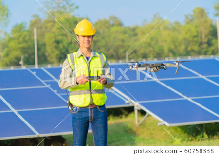 Engineer man or worker, people, using a drone to 60758338