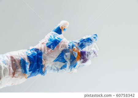 Big plastic hand made of garbage isolated on white studio background Big plastic hand made of garbage isolated on white studio background 60758342