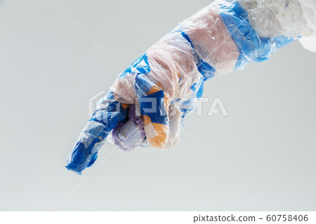 Big plastic hand made of garbage isolated on white studio background 60758406
