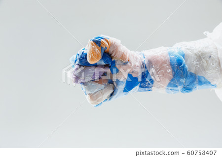 Big plastic hand made of garbage isolated on white studio background Big plastic hand made of garbage isolated on white studio background 60758407