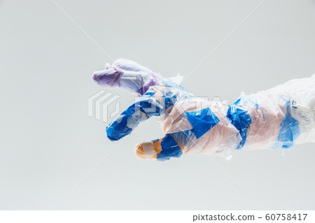 Big plastic hand made of garbage isolated on white studio background Big plastic hand made of garbage isolated on white studio background 60758417