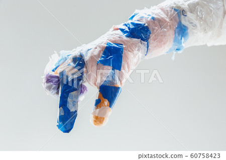 Big plastic hand made of garbage isolated on white studio background Big plastic hand made of garbage isolated on white studio background 60758423