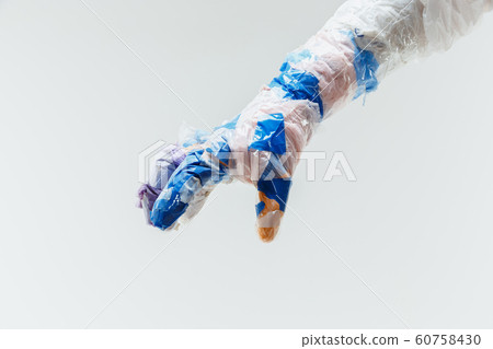 Big plastic hand made of garbage isolated on white studio background Big plastic hand made of garbage isolated on white studio background 60758430