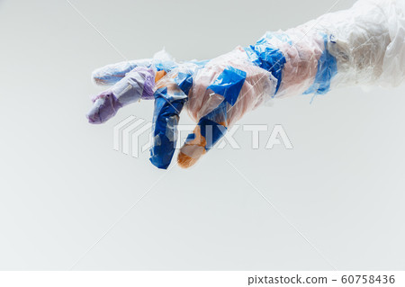 Big plastic hand made of garbage isolated on white studio background Big plastic hand made of garbage isolated on white studio background 60758436