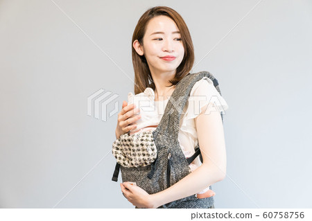 Mother holding an infant 60758756