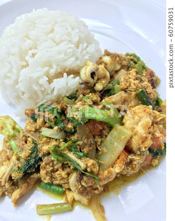 Stir fry mixed-seafood with with yellow curry Stir fry mixed-seafood with with yellow curry 60759031