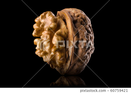 Half opened walnut with kernel isolated on a black background with clipping path Half opened walnut with kernel isolated on a black background with clipping path 60759421