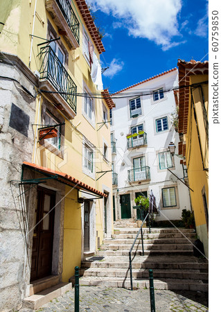 Beautiful old steepy streets at Lisbon city center 60759850