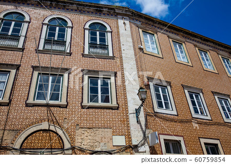 Traditional architecture of the facades covered with ceramic tiles called azulejos in the city of Lisbon in Portugal Traditional architecture of the facades covered with ceramic tiles called azulejos in the city of Lisbon in Portugal 60759854