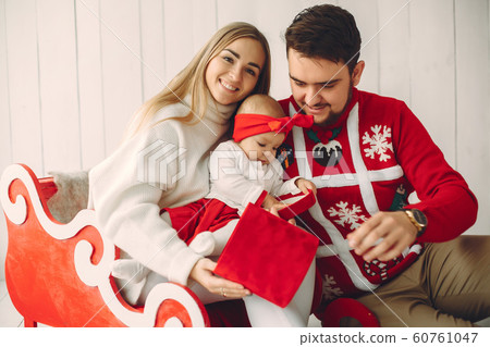 Family sitting at home with christmas gifts 60761047