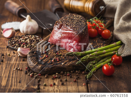 Slice of Raw Beef Topside Joint with Salt and 60761558