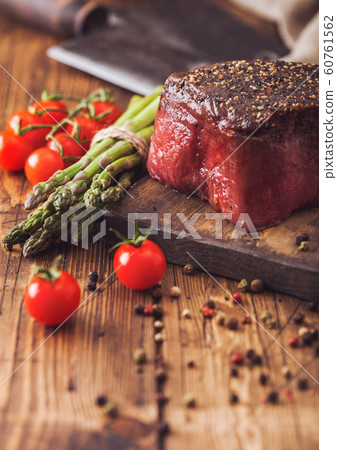 Slice of Raw Beef Topside Joint with Salt and 60761562