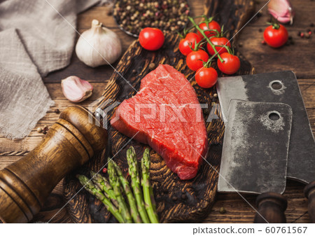 Slice of Raw Beef sirlion steak on wooden chopping 60761567