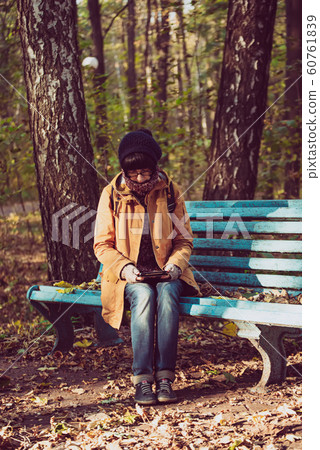 Hipster girl in a park Hipster girl in a park 60761839