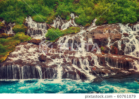 Hraunfossar waterfalls in Iceland Hraunfossar waterfalls in Iceland 60761879