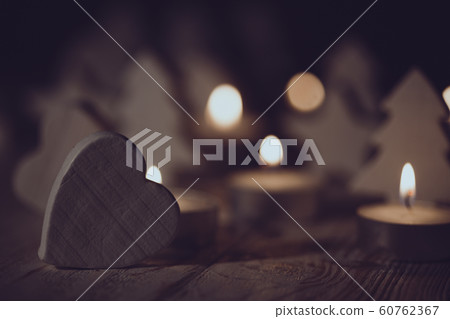 Christmas background of candles and wooden toys Christmas background of candles and wooden toys 60762367