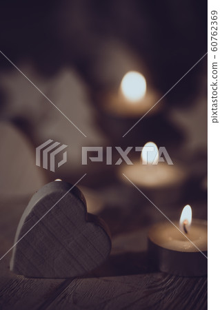 Christmas background of candles and wooden toys Christmas background of candles and wooden toys 60762369