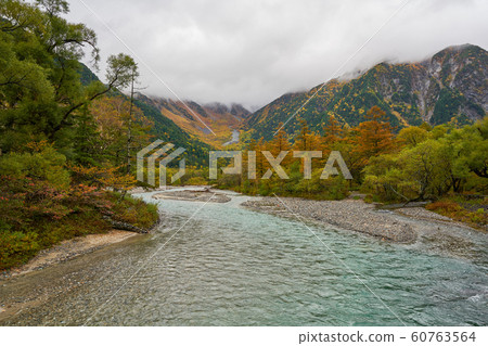 autumn season in kamikochi nagano view with fog in autumn season in kamikochi nagano view with fog in 60763564