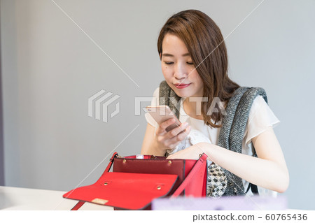 A woman shooting a bag 60765436