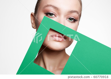 Beautiful young woman with color paper Beautiful young woman with color paper 60770918