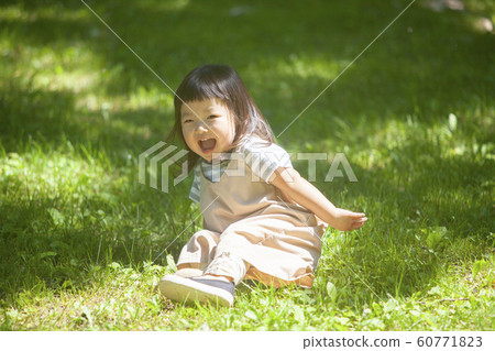 Girls playing in the park Girls playing in the park 60771823