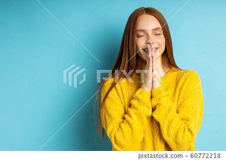 Studio shot of redhead caucasian young woman 60772218