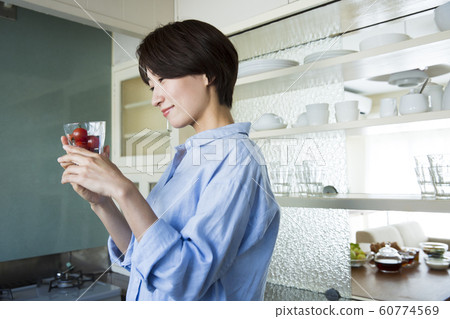 Kitchen kitchen housewife woman young woman housework cooking ingredients lifestyle tomato Kitchen kitchen housewife woman young woman housework cooking ingredients lifestyle tomato 60774569