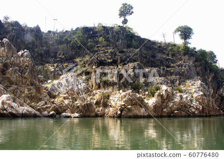 Marble Hill beside Narmada River 60776480