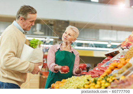 Grocery Shop Assistant Helping Customer 60777700
