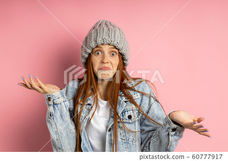 Portrait of excited young woman dressed denim 60777917