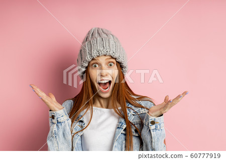 Portrait of excited young woman dressed denim 60777919