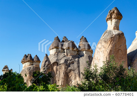 Magic fungous forms of sandstone in the canyon near Cavusin village, Cappadocia Magic fungous forms of sandstone in the canyon near Cavusin village, Cappadocia 60778401