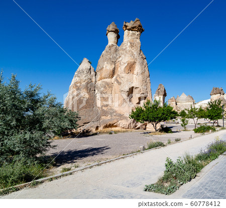 Magic fungous forms of sandstone in the canyon near Cavusin village, Cappadocia Magic fungous forms of sandstone in the canyon near Cavusin village, Cappadocia 60778412