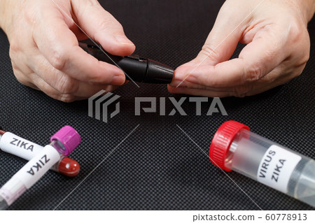 Zika virus concept footage with test tube on black 60778913