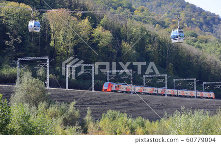 High-speed passenger train moves through a 60779004