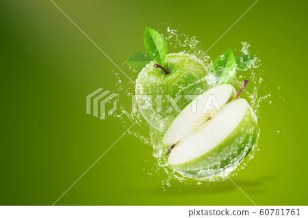 Water splashing on Fresh green apple on Green 60781761
