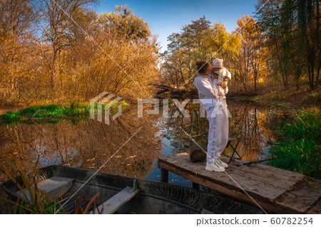beautiful young mom with baby in autumn beautiful young mom with baby in autumn 60782254
