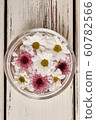 Beautiful white and pink chrysanthemums in a glass 60782566