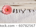 Beautiful pink gerbera with tools for manicure and 60782567