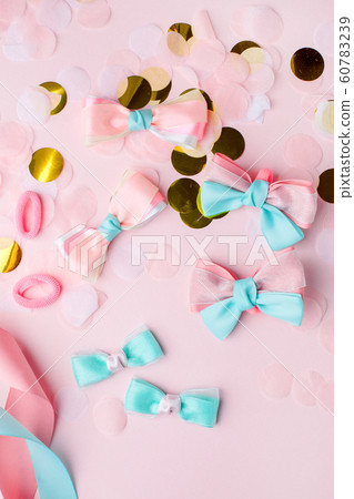 Set of baby accessories for hair on a pink pastel Set of baby accessories for hair on a pink pastel 60783239