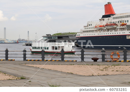 Nippon Maru and sightseeing boat moored at Osanbashi 60783281