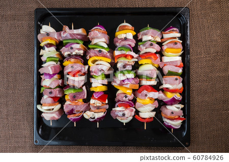 Raw pork skewers ready for grilling 60784926