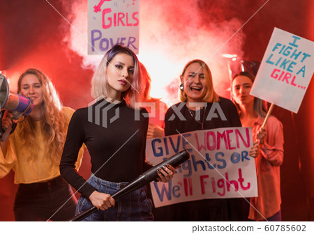 young caucasian women activist holding posters young caucasian women activist holding posters 60785602