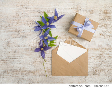 Gift box, blue flowers and greeting card Gift box, blue flowers and greeting card 60785646