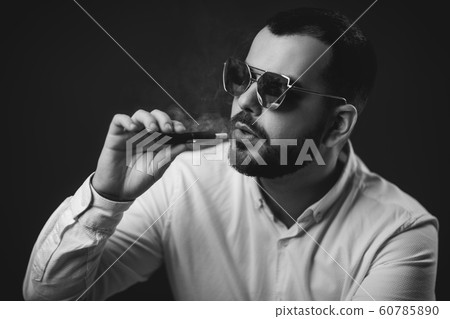 man in sunglasses and white shirt smoking man in sunglasses and white shirt smoking 60785890