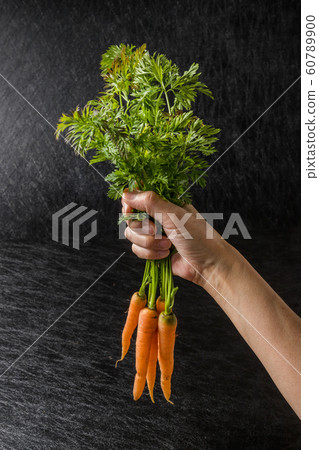 Cute carrots grown without pesticides 60789900