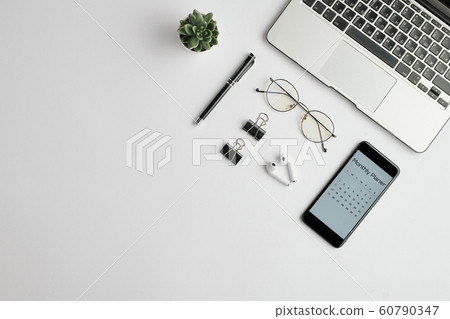 Cordless earphones, eyewear, pen, clips, monthly planner in the phone and laptop 60790347