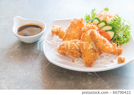 fried fish with tonkatsu sauce fried fish with tonkatsu sauce 60790422