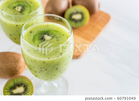 Healthy fresh kiwi smoothie in glass Healthy fresh kiwi smoothie in glass 60791049